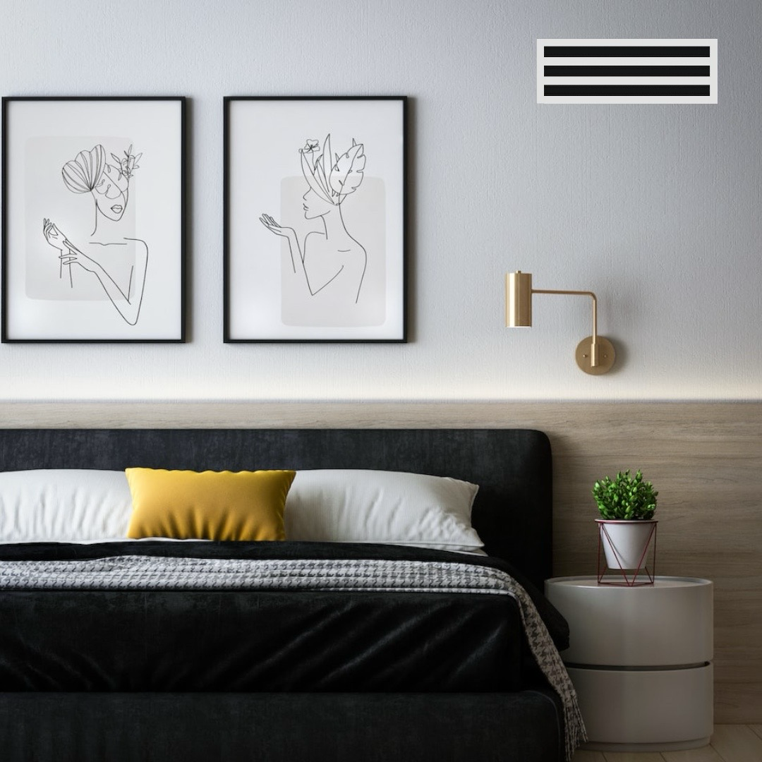 Modern bedroom installed with Cryptic Air 3-slot linear slot diffuser, modern AC vent cover above black bed and yellow pillow